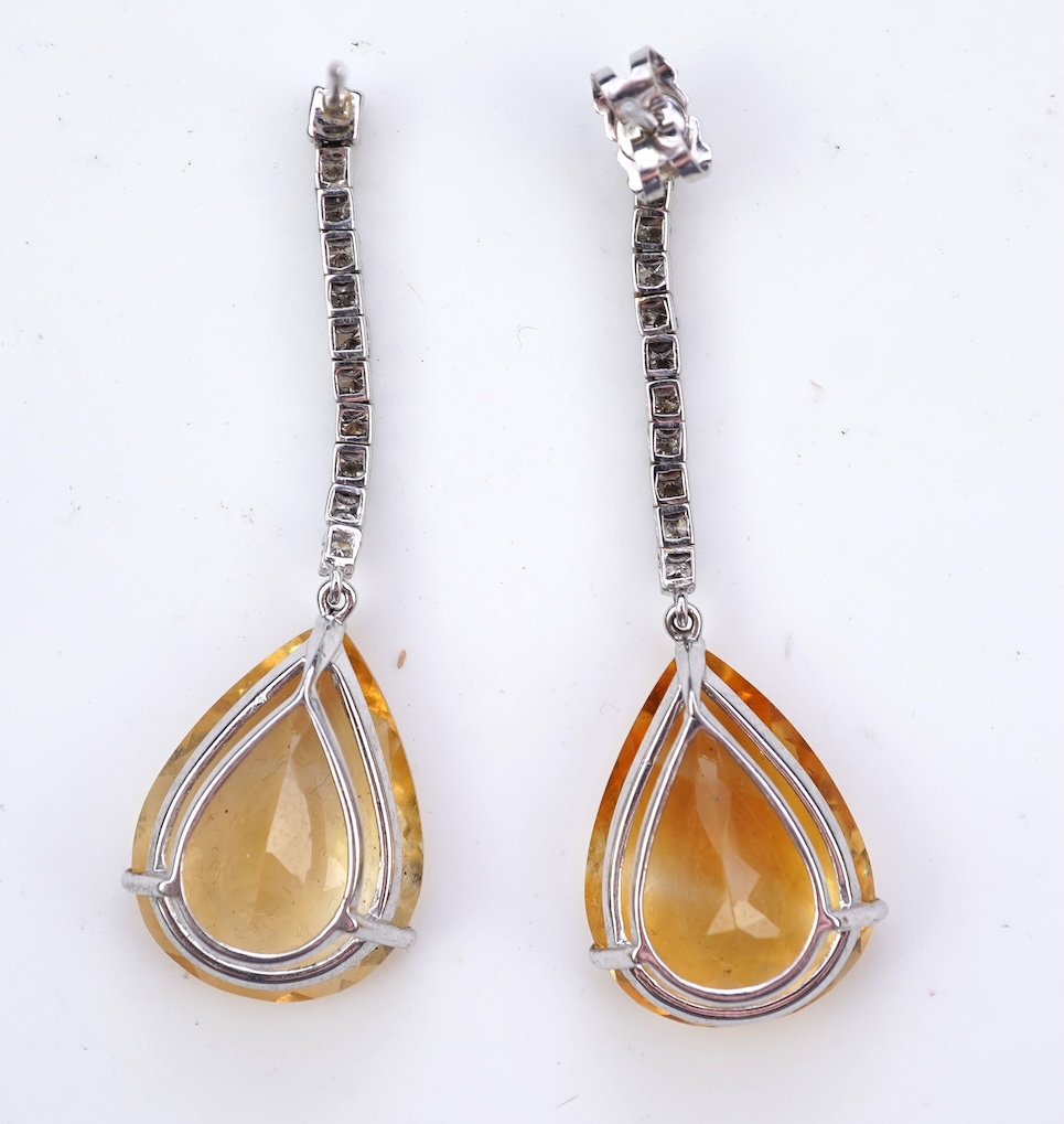 A pair of citrine and diamond earrings